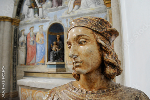 Bust of Raffaello Sanzio, known as Raphael. On the background there is a fresco painted by Raffaello Sanzio. Chapel of San Severo, Perugia, Italy