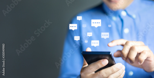 Live chat chatting and social network concepts, Close-up hands using mobile smartphone with chat box icons