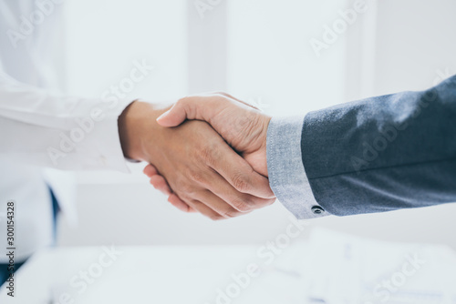 Teamwork,partnership and Social connection in business join hand together,Finishing up a meeting,handshake of happy business people after contract agreement to become a partner,collaborative teamwork.