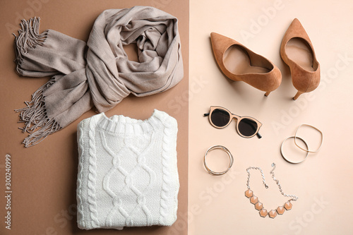 Flat lay composition with accessories and clothes on color background