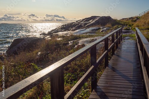 Northern landscapes. Lakes of Finland. View from the Sveaborg fortress. A wooden bridge near the shore. Northern landscapes of Finland. Traveling in Finland. Landscape of the surroundings of Helsinki