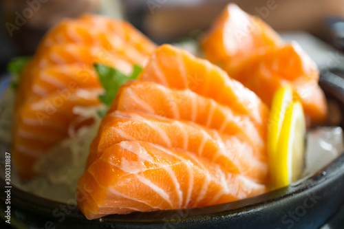 Salmon raw on a plate. Salmon sashimi.