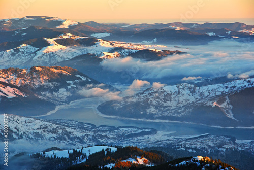 Aerial winter panorama over misty valley