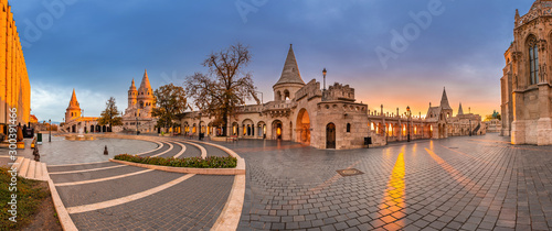 Budapest, Hungary - Panoramic view of the famous Fisherman's Bastion (Halaszbastya) and Matthias Church with a beautiful autumn sunrise and clear blue sky