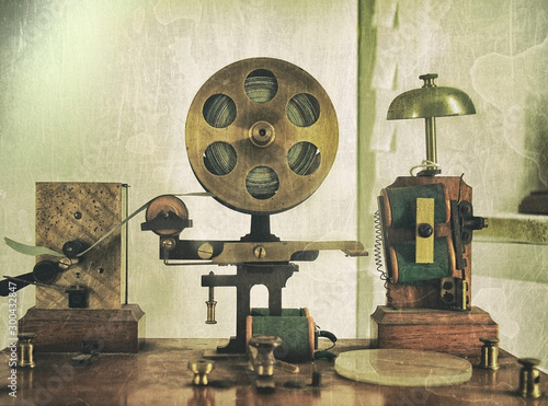 vintage effect image of an old morse code telegraph machine with bell and brass printer