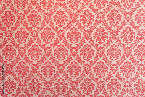 Red wallpaper vintage flock with red damask design on a white background retro vintage style