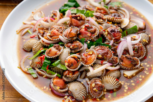 Cockle Salad,Cockles salad / Hot and spicy shellfish blood cockles salad mix vegetable tomato herb and spices thai style food