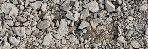 Panoramic image. Gray gravel stones for the underground in road construction