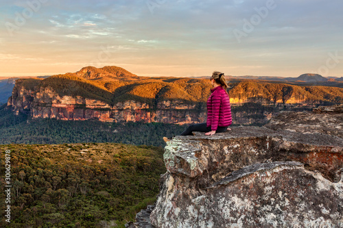 Woman taking in early morning mountain views