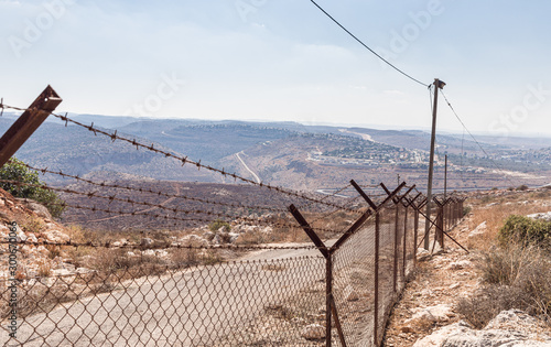 Barbed wire fence enclosing the village Peduel in the Samaria region in Benjamin district in Israel