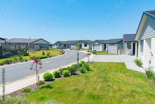 New subdivision street with uniform homes.