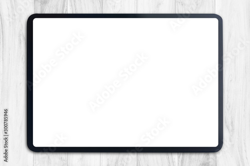 Digital tablet mock up on white wood table with Clipping path on tablet blank screen easy replace you design