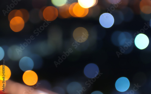 bokeh city abstract defocused, blur circle colors, on black background 