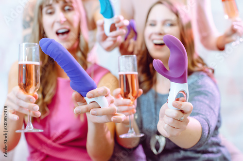 Women showing sex toys they bought at a dildo party