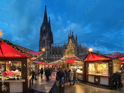 Cologne Cathedral Christmas Market in twilight, Germany. This is the most popular and best-known of all the city markets in front of the famous Cologne Cathedral.