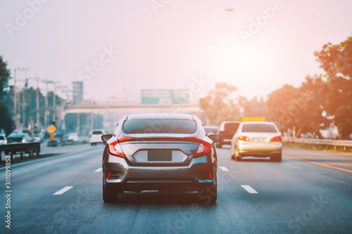 Car Driving on road and Small passenger car seat on the road used for daily trips