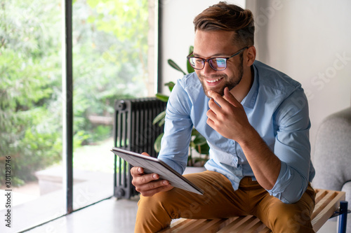 Males hands holding digital tablet 