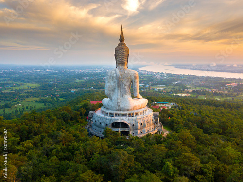 Top view Aerial photo from flying drone.Big Buddha Wat Phu Manorom Mukdahan Thailand.Buddha on the mountain.