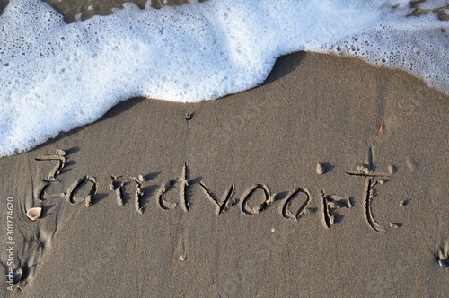 Zandvoort written on sandy beach on a North Sea in the Netherlands on Zandvoort beach