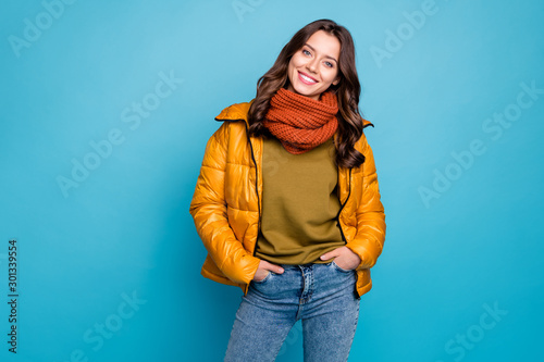 Photo of amazing millennial lady easy-going person holding hands pockets wear modern stylish autumn windbreaker jeans scarf isolated blue color background