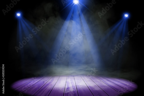 Blue purple lighting and smoke on stage with floor wood