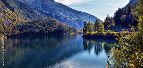 beautiful view of a mountain lake in the autumn sunny day. Poschiavo, Switzerland