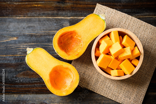 Half and slice butternut squash in a bowl for cooking