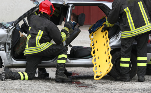 Team of firefighters on the road after the crash