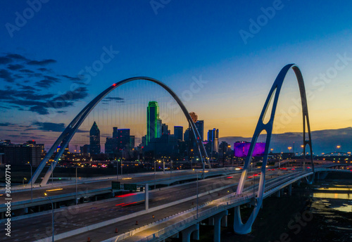 Dallas skyline at twilight over bridge