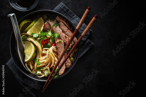 Tasty asian classic soup with noodles and meat