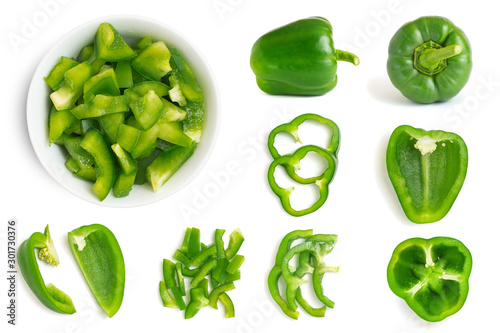 Set of fresh whole and sliced green bell pepper isolated on white background. Top view