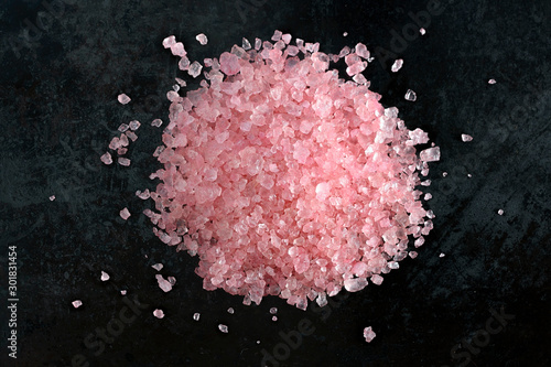 Pink himalayan salt on black background, macro