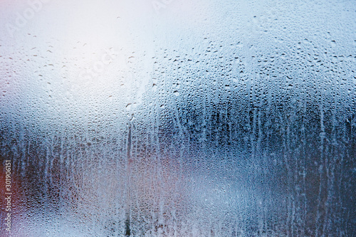 Textural abstract background of foggy glass.