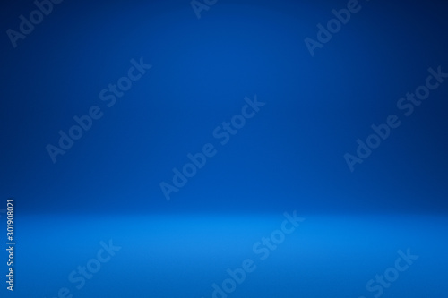 Empty blue background and spotlight with studio for showing or design. Blank backdrop made from cement material. Realistic 3D render.