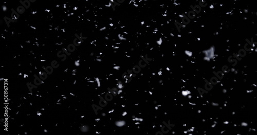 Falling real snowflakes, heavy snow, shot on a black background, frosted, wide-angle, insulated, ideal for digital composition, post-production