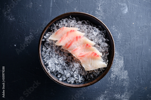 Sashimi Japanese food, slices of sashimi perch on ice. Sliced fish in an expensive restaurant