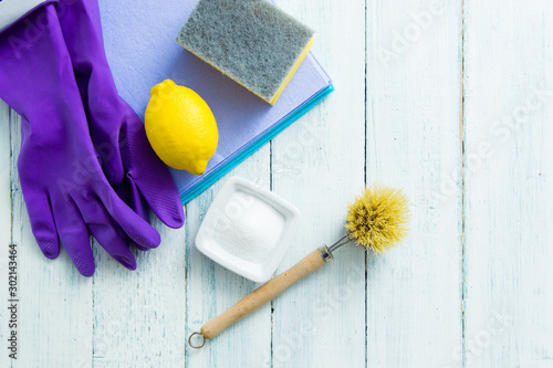 dishwashing tools and citric acid, lemon on white wooden