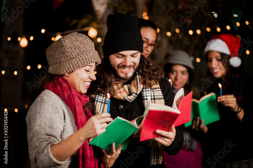 Mexican Posada, friends Singing carols in Christmas in Mexico