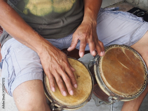 Cuban instructor playing percussion bongo, Santiago de Cuba, Cuba