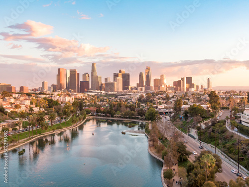 Aerial view of downtown Los Angeles California city skyline and skyscraper buildings during golden hour before sunset.