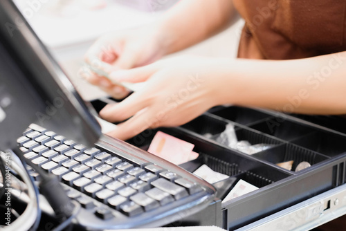 hands working on cashier