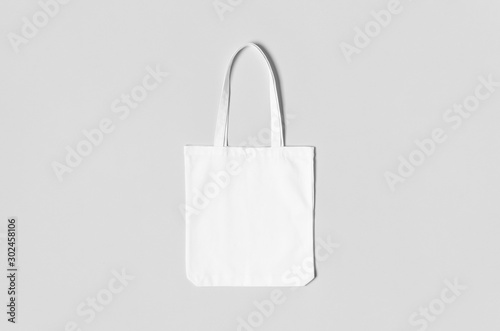 White tote bag mockup on a grey background.