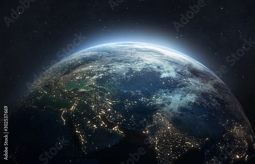 Nightly planet Earth in dark outer space. Civilization. Elements of this image furnished by NASA