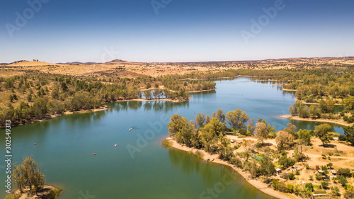 Amazing lake with cristal water surrounded by trees. Mina de S. Domingos, Mertola Alentejo Portugal. drone photo.