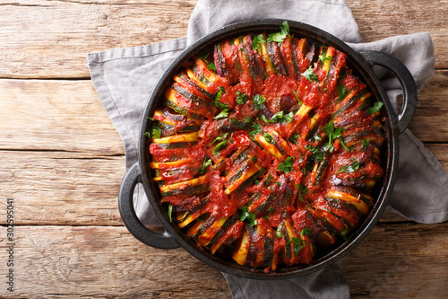 Tasty homemade Greek briam made of vegetables close-up in a pan. Horizontal top view