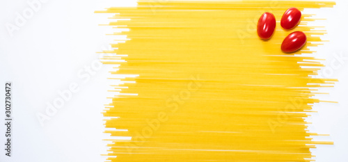 Dry spaghetti on a white background. Italian pasta. A place to copy. Food and healthy eating. Isolated