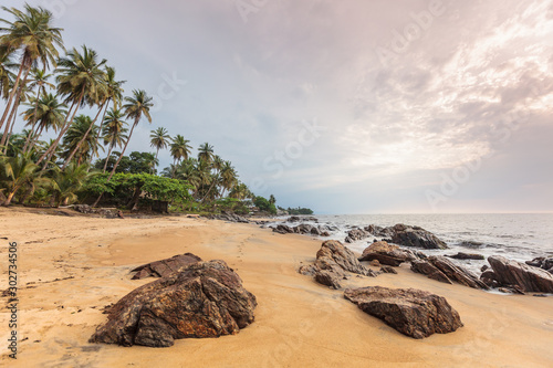 Cameroon, South Region, Ocean Department, Kribi, sandy beach and palm trees by the sea