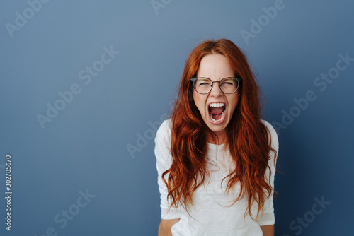 Angry young woman throwing a temper tantrum