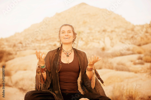 Woman priestess shaman in a joyful welcoming expression. 