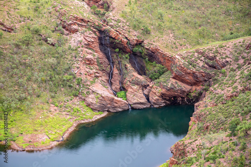 Aerial landscape view of Home Creek waterfall where it enters Lake Argyle, the largest man made lake in Australia in the remote Kimberley region of Australia.